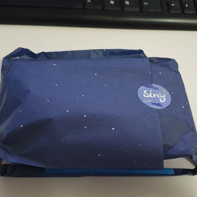 Ah i forgot to open this yest and take pics. Recently @sinycath did a draw for each tier of their patreon to give away a special little gift and i won the tier i am in!!!!!!!!!🤩🤩🤩🤩🤩 got my lil gift yest (probably arrived a few days earlier but i get mail sent to my work these days). I got some stickers and cute keychains and a fish pin!!!!!!! I love Sinys original art just as much as their fanart. Ok its true i have a bias towards that blue coz i like my hair that colour lolol. But i was so surprised and happy to be the winner of the draw. Thank you again Siny!!! As always i love your packaging!!!! #artistsoninstagram #patreonsupporter #sinycath
